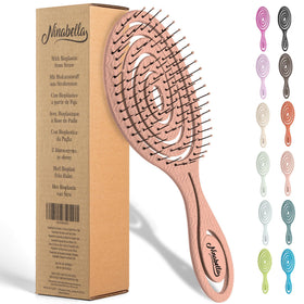 Ninabella front view rose gold brush showing ergonomic handle and spiral head, comfortable grip