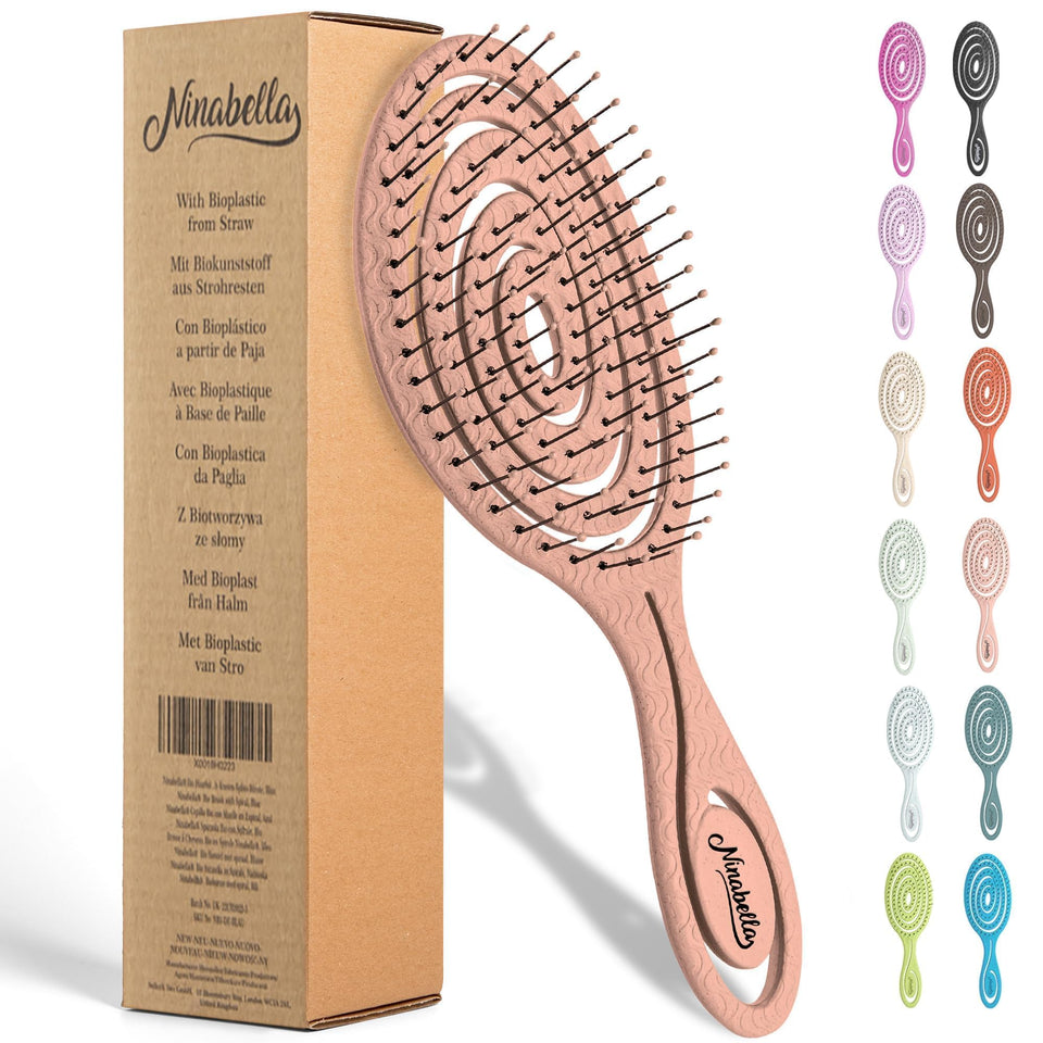 Ninabella front view rose gold brush showing ergonomic handle and spiral head, comfortable grip
