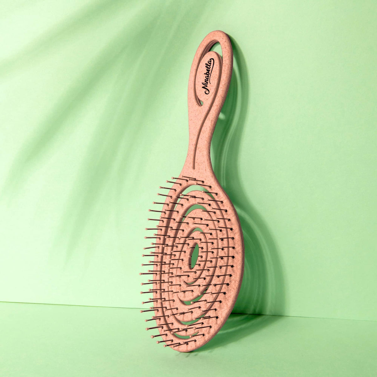 Ninabella in use on wet hair illustrating safe detangling, minimizes strand stress