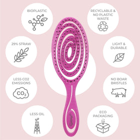 Ninabella brush held in hand to show compact size and travel-friendly scale