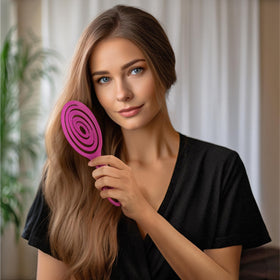 Ninabella brush smoothing a wig and extensions to protect fibers and prevent snags