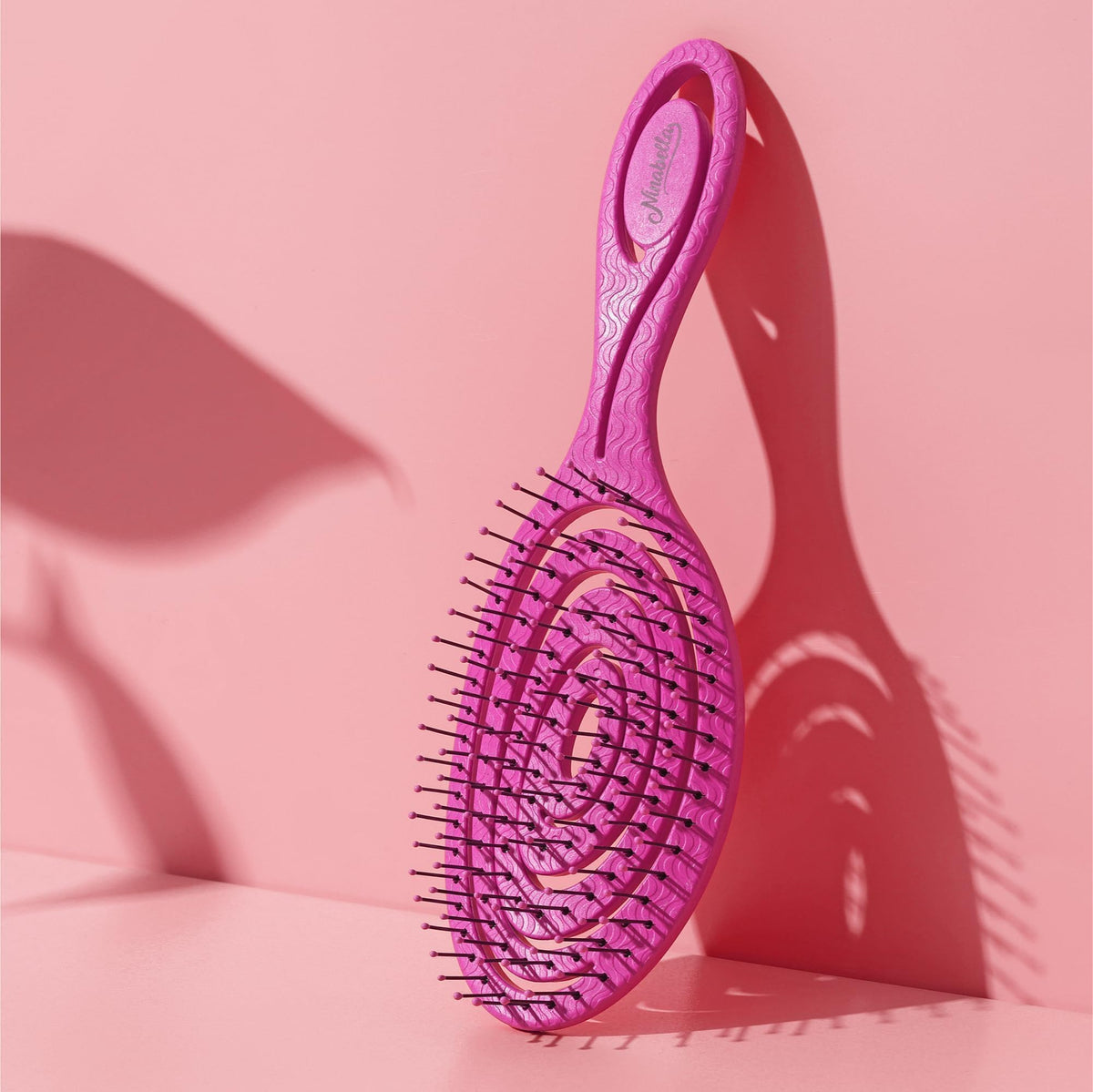 Ninabella brush used on wet hair in shower offering tangle-free conditioning benefit