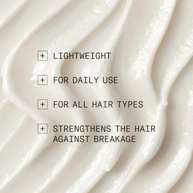 NIOXIN conditioner being applied to wet hair for improved manageability