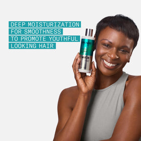 NIOXIN conditioner being dispensed onto palm for controlled application