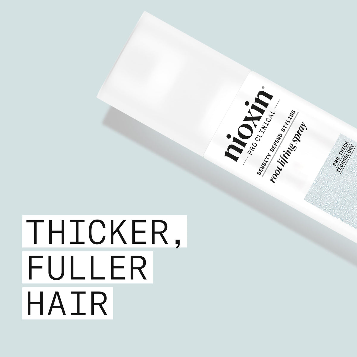 Nioxin mist closeup showing fine spray pattern for even root-to-end application and lightweight coverage