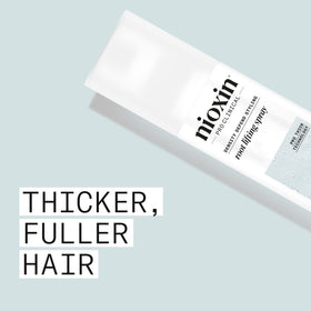 Nioxin mist closeup showing fine spray pattern for even root-to-end application and lightweight coverage