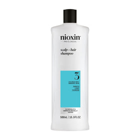 NIOXIN front bottle view showing product packaging and benefit