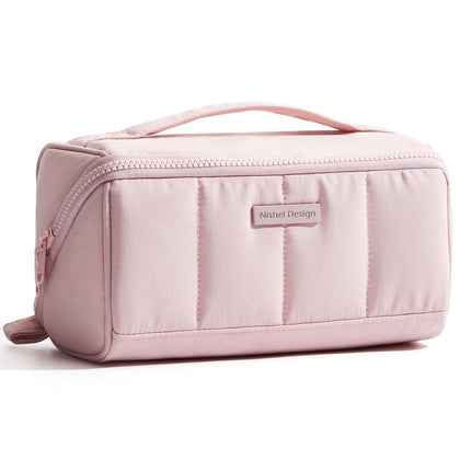 NISHEL front view showing fluffy pink structured exterior and zipper, stylish storage