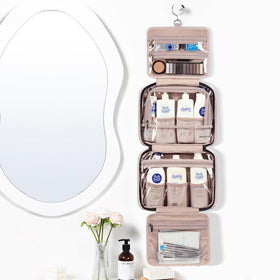 NISHEL open flat showing four compartments for neat travel organization