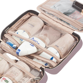 NISHEL next to travel bottles showing medium size and packing efficiency