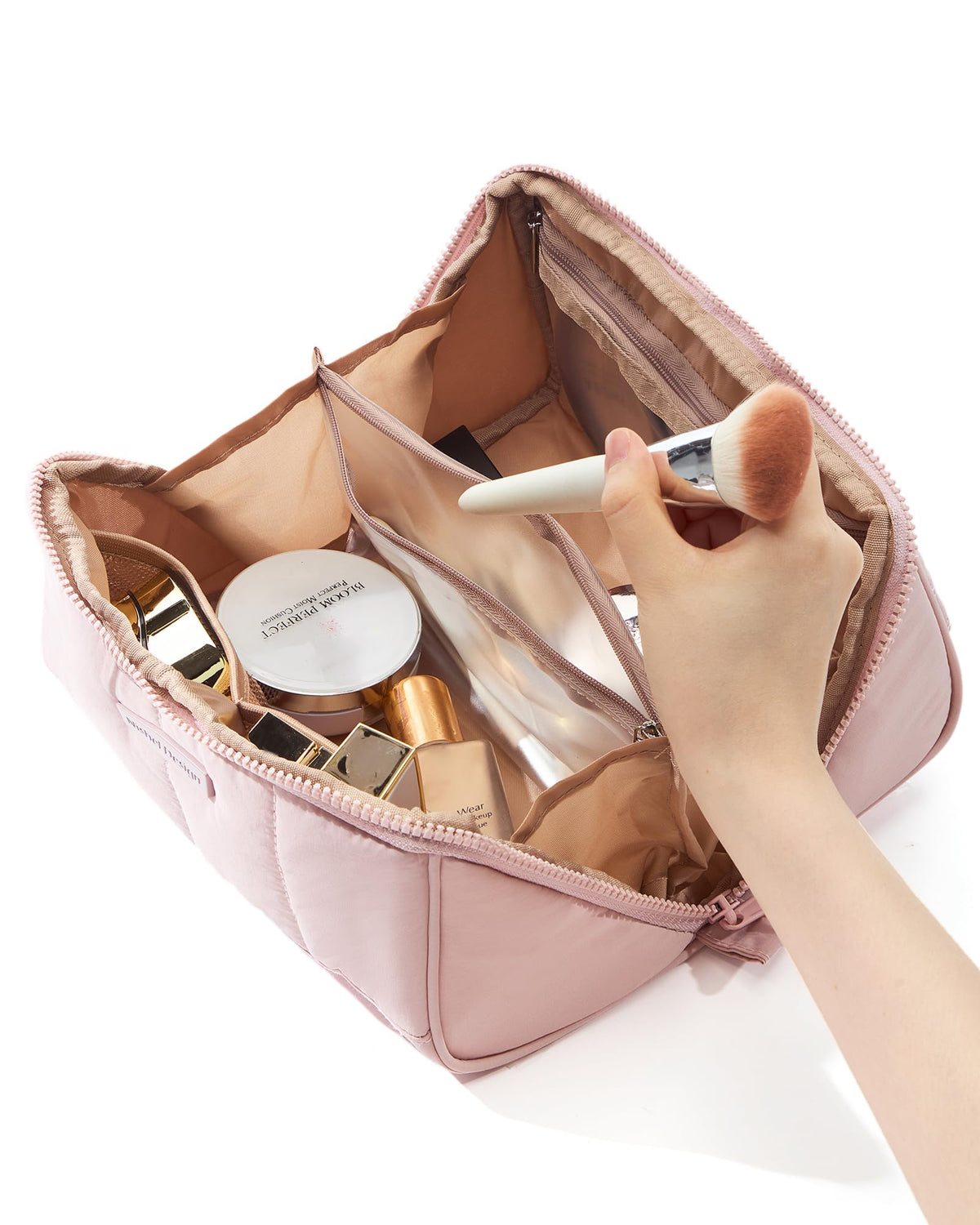 NISHEL zippered side compartment securing liquids and small items during travel