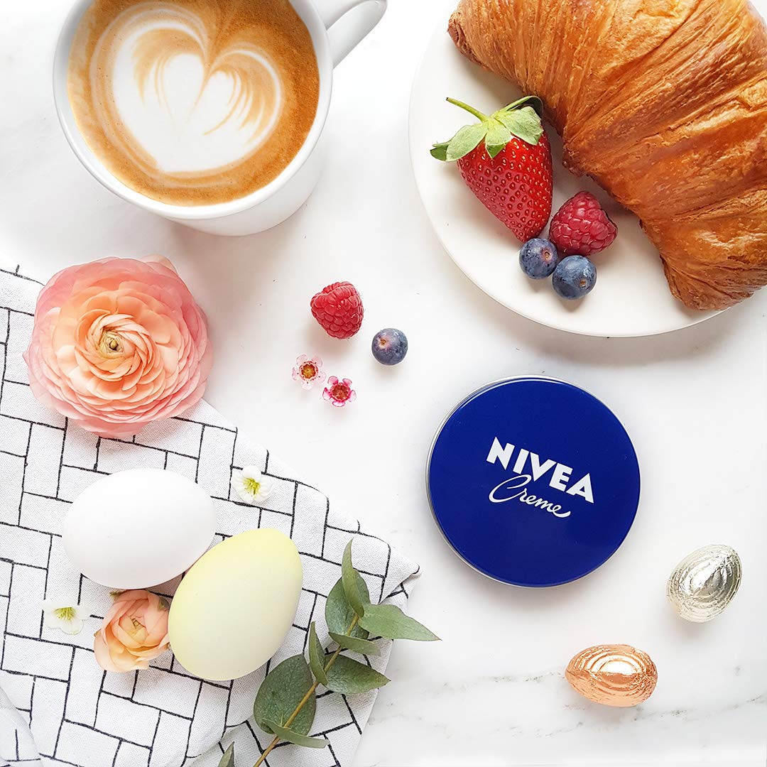 Three-pack arrangement of NIVEA Creme 200ml conveying value and household supply
