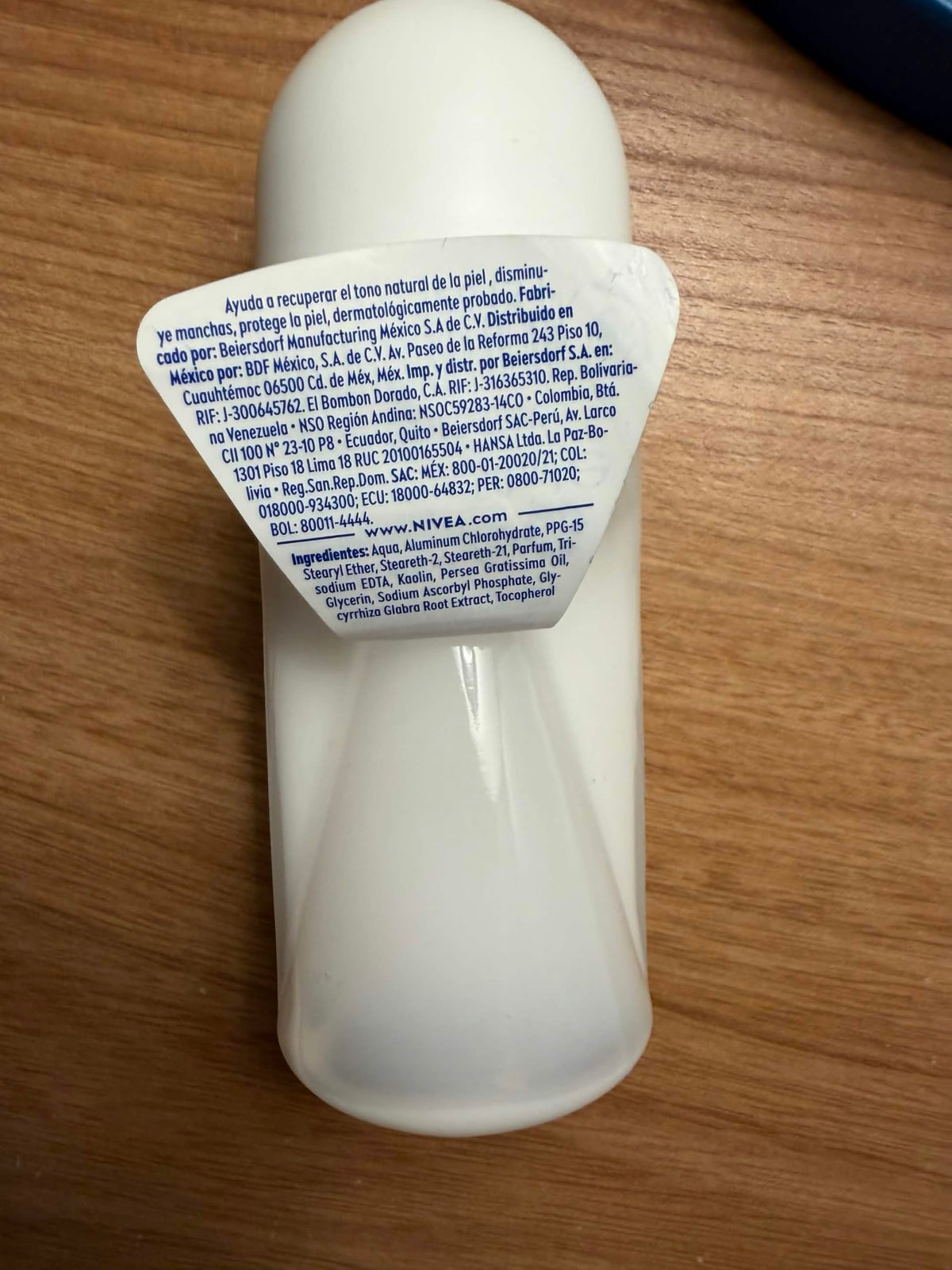 NIVEA roll-on held in hand demonstrating compact travel-friendly size