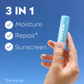 Close-up of NIVEA lip balm label highlighting SPF 15 and ingredients