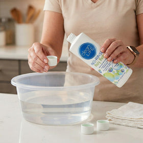 No-Rinse pouring into cup demonstrating dilution ease and economical use
