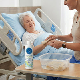 Caregiver using No-Rinse for a sponge bath showing gentle, residue-free clean