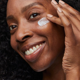 No7 product being applied to cheek by hand, demonstrates easy application