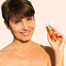 Noche Y Dia bottle on bathroom vanity conveying daily skincare routine