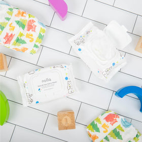 Nolla wipes in a diaper bag during outing showing quick mess cleanup benefit