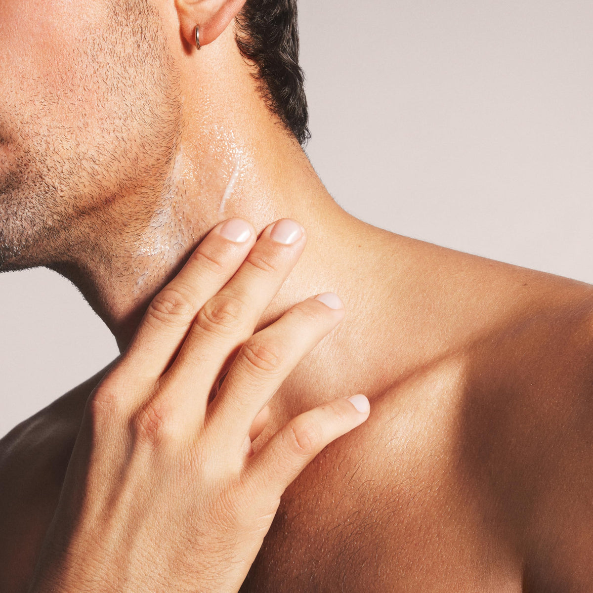 Nood in bathroom routine setting conveying calming post-shave ritual benefit