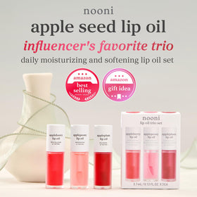 NOONI lip oil held in hand for size comparison showing compact, travel-friendly tubes