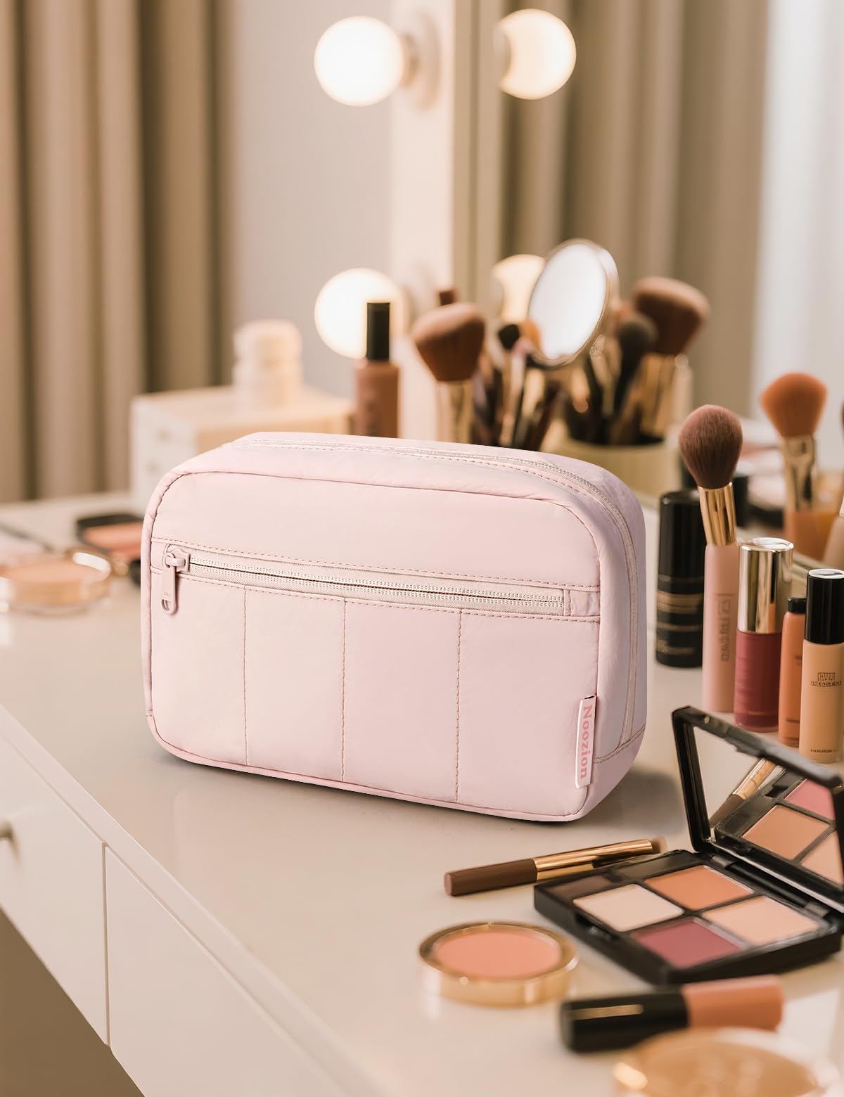 Noozion pouch inside a carry-on suitcase prepared for travel convenience