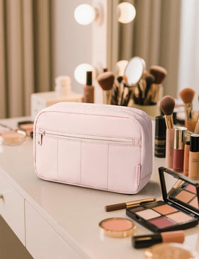 Noozion pouch inside a carry-on suitcase prepared for travel convenience
