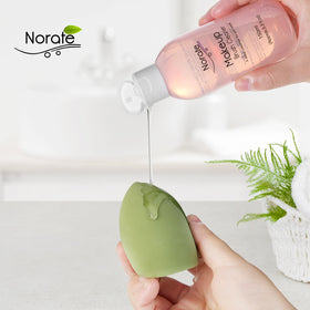 Norate cleaning in action with brush on mat demonstrating faster cleaning