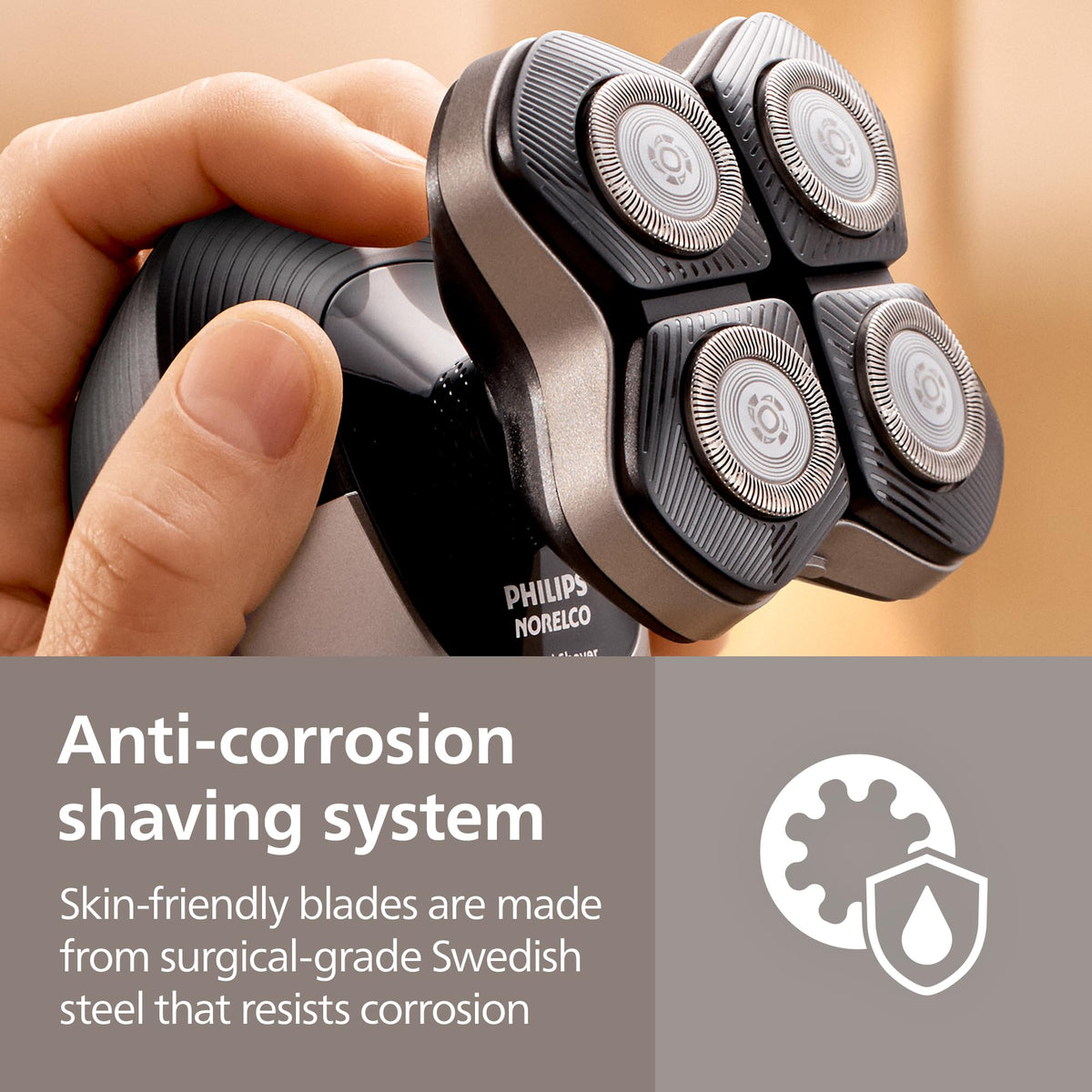 Norelco replacement head held in hand showing size and easy install