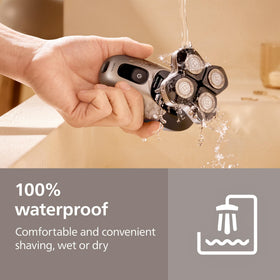 Norelco Head Shaver used in shower for wet shaving versatility