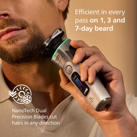 Norelco i9000 in hand demonstrating size and ergonomic grip for comfortable control