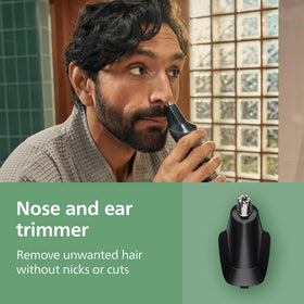 Norelco being used to trim beard offering precise control and comfort