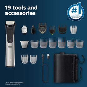 Norelco Multigroom 7000 with soft pouch next to phone showing compact travel-friendly size