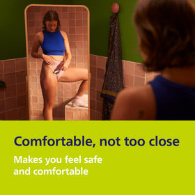 Norelco OneBlade Intimate next to USB-A cable showing convenient rechargeable travel charging