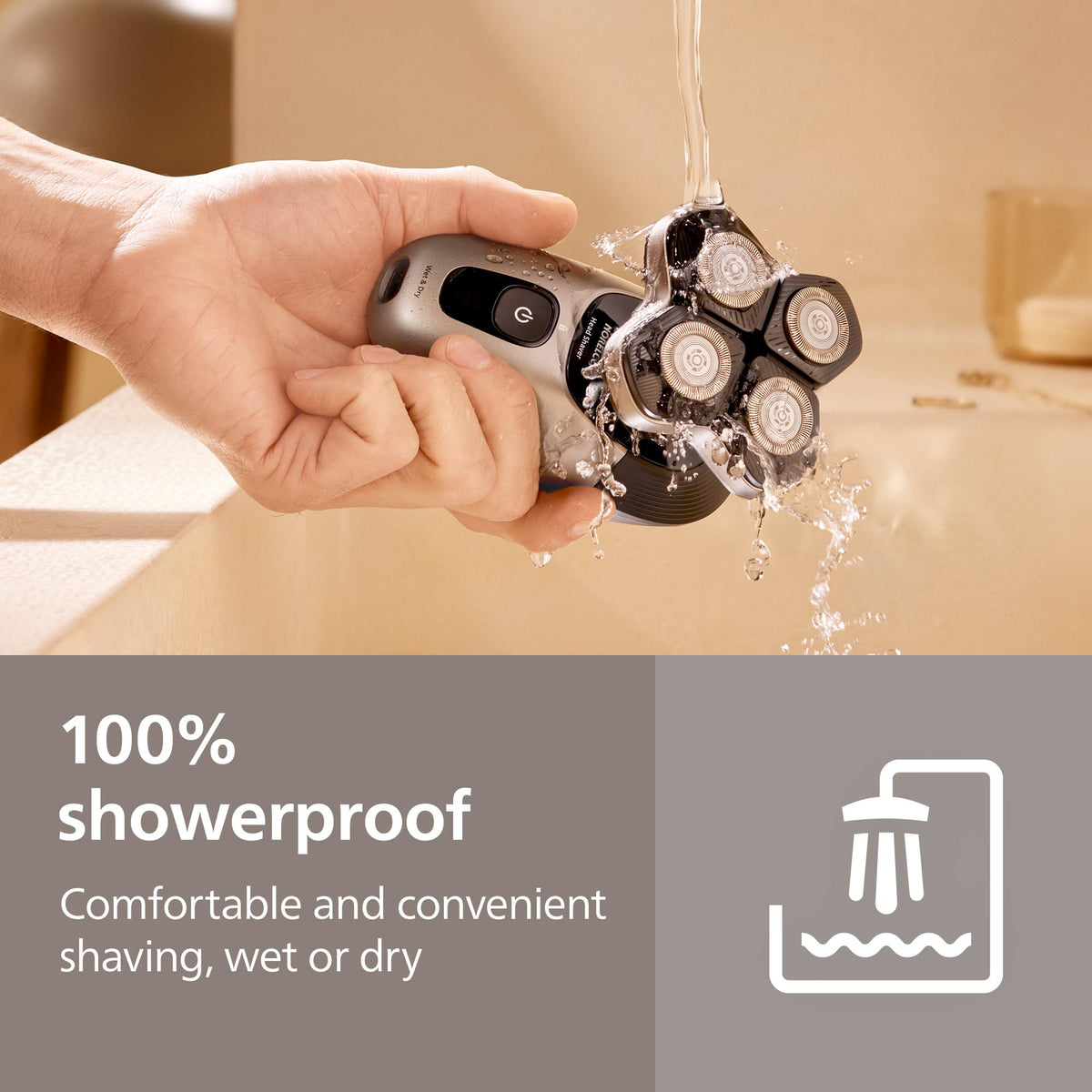 Philips Norelco next to a hand showing compact size and easy maneuverability