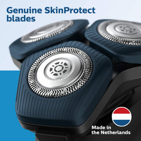 Norelco heads next to ruler showing compact size and easy handling benefit