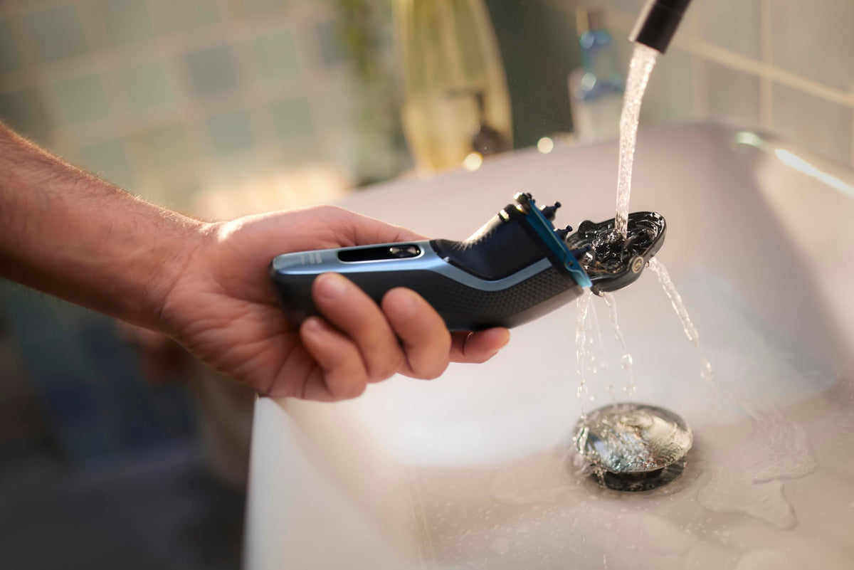Norelco storm blue shaver on bathroom counter in lifestyle setting for daily grooming