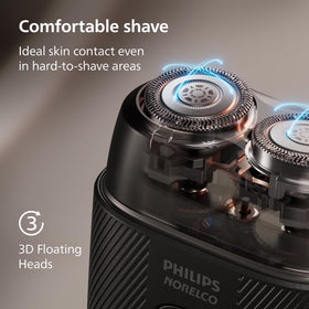 Norelco shaver 500 held in hand to show compact travel-friendly size and control