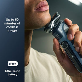 Norelco shaver 5400 being used in shower for wet shaving convenience and easy rinse benefit