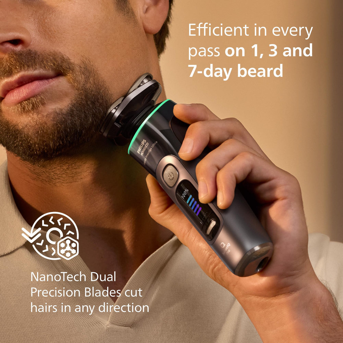 Philips Norelco i9000 held in hand to show scale and ergonomic grip for controlled passes