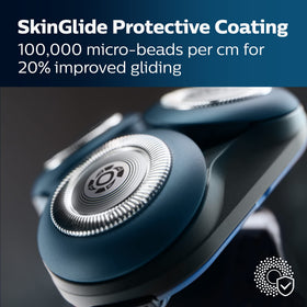 Norelco shaving head close-up highlighting SkinGlide coating for smoother glide