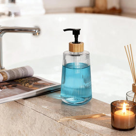 Nortsa Miira dispenser at kitchen sink demonstrating easy soap dispensing and clean look