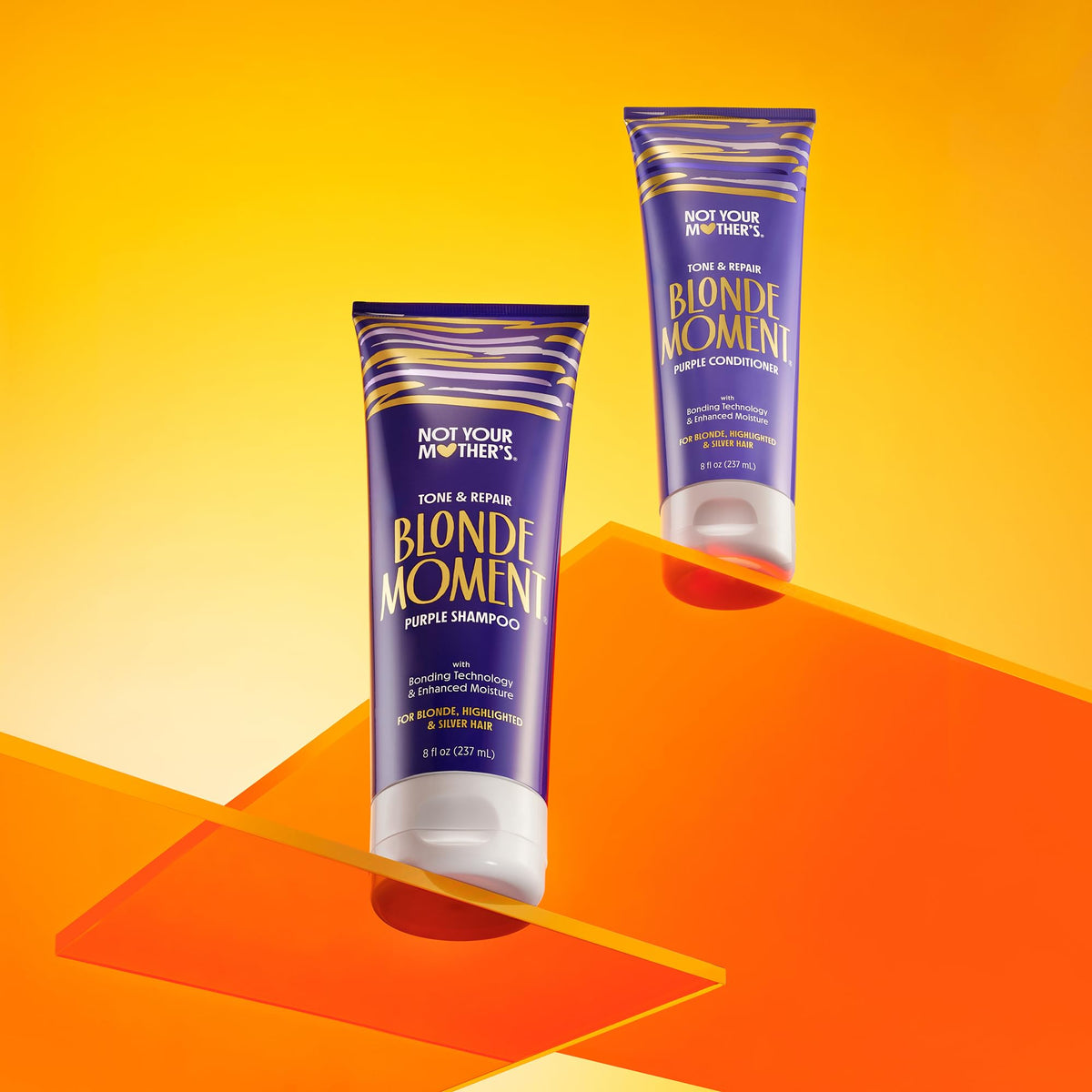 Not Your Mother's duo held in hand for scale, shows travel-friendly 8 fl oz bottles