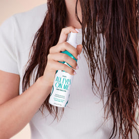 Not Your Mother's bottle held in hand to show 6 fl oz size and portability