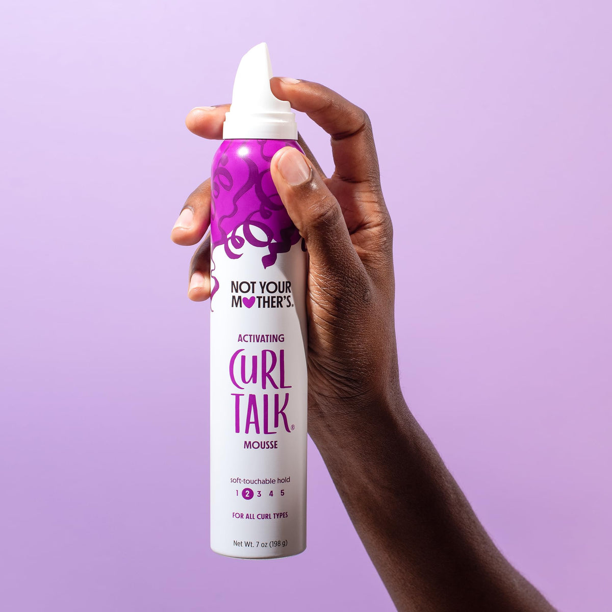 Not Your Mother's products being applied to damp hair demonstrating styling method