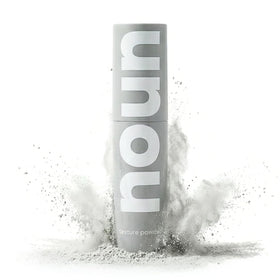 NOUN front bottle shot showing powder-spray design and clean formula benefits
