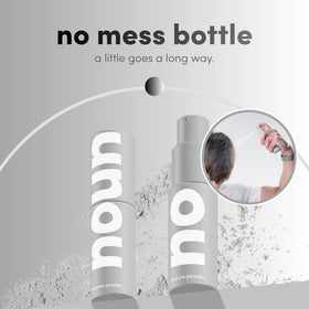 NOUN bottle in hand for scale showing travel-friendly size and precision