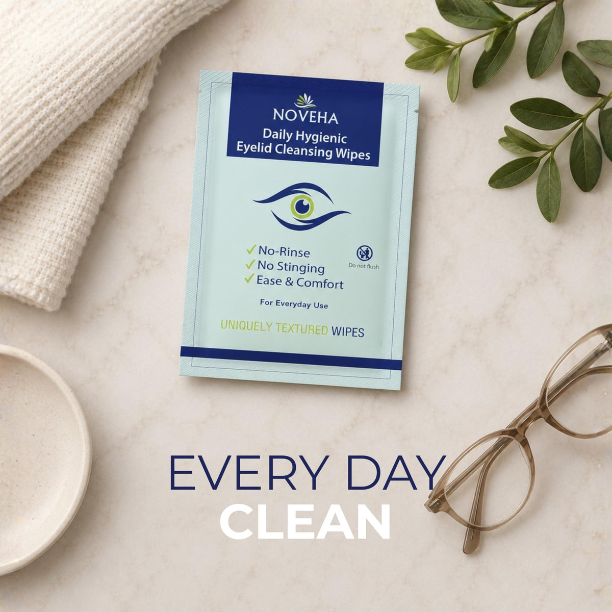 NOVEHA wipe in hand for size comparison showing compact, single-use practicality