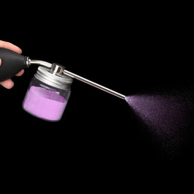 Noverlife held in hand to show compact size and travel convenience