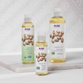 NOW Foods castor oil beside common items to show 16-ounce size and value